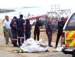 Rescue workers retrieve the bodies of those killed in the plane crash. Rescue workers retrieve the bodies of those killed in the plane crash. Photograph by: JANINE OELOFSE 