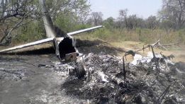The wreck of a crashed plane lays in the bush in the Okavango Delta. The light aircraft carrying 12 people crashed shortly after takeoff killing the British pilot and seven tourists from France, Switzerland and Britain.